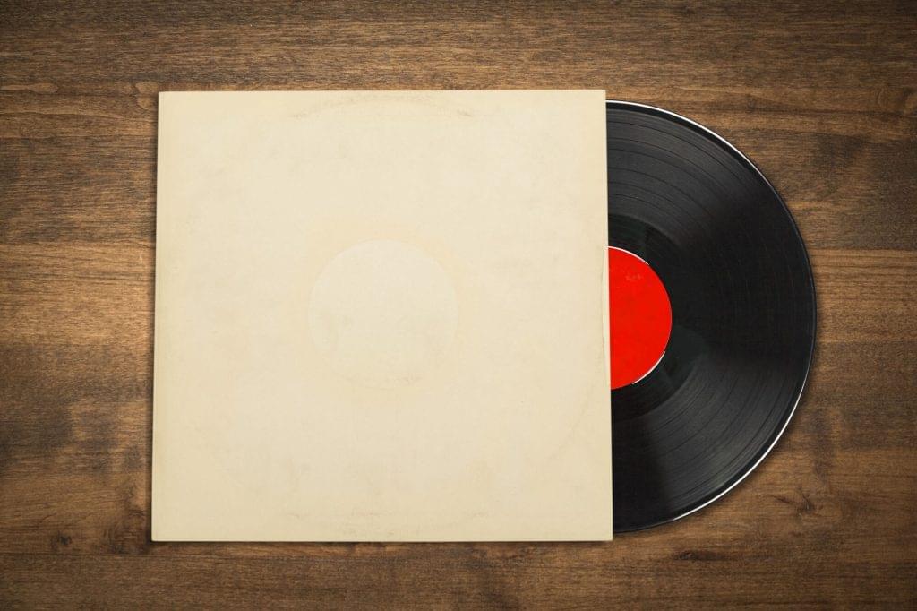vinyl record with blank cover wooden desk